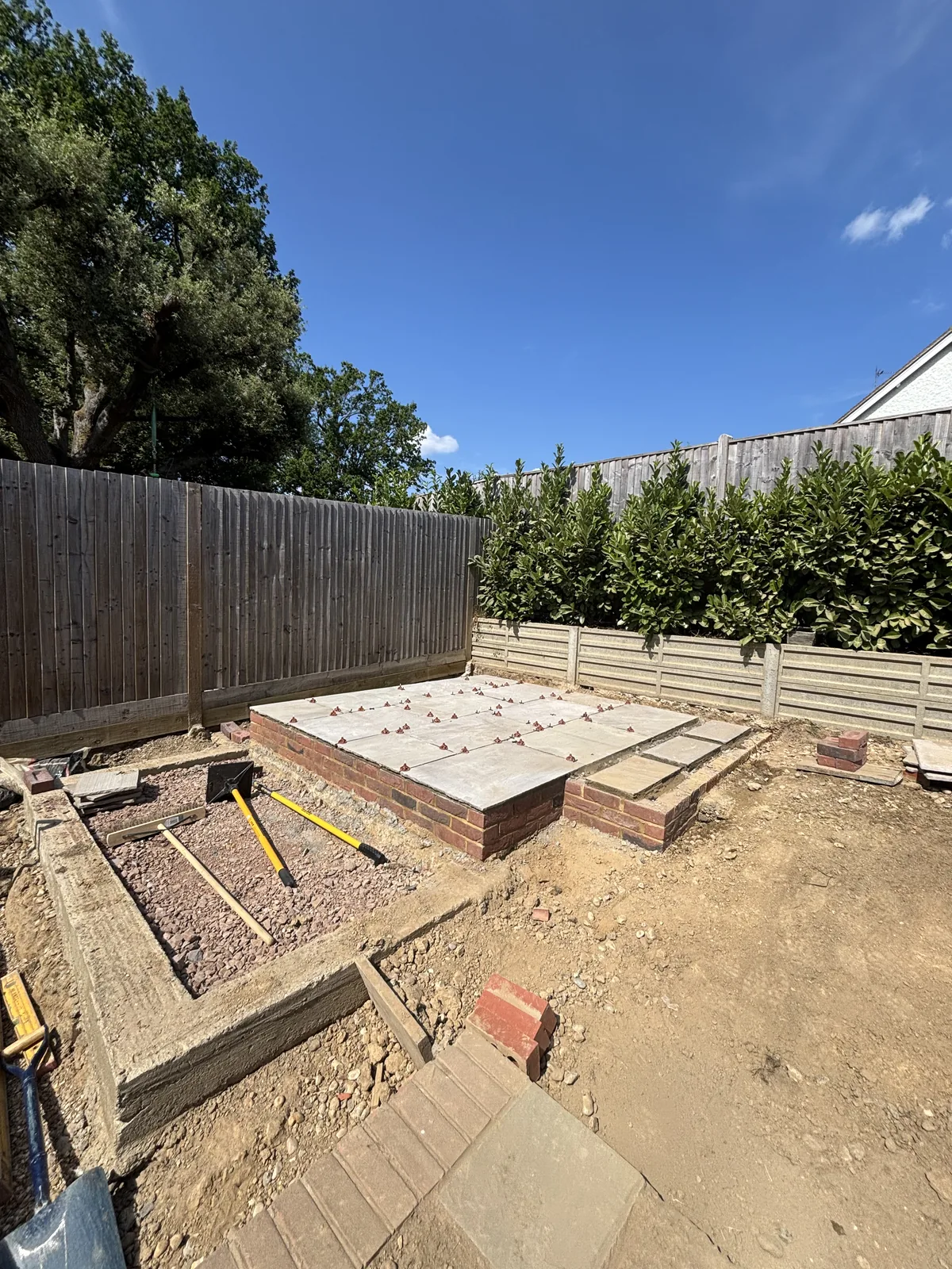 Excavation and timber formwork for the new paving and beds