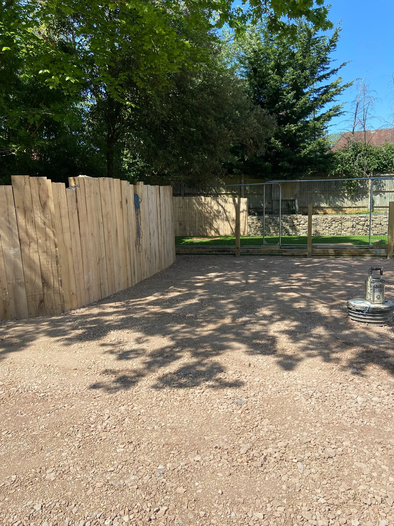 Upright oak sleeper wall dividing garden areas in Brighton and Hove